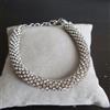 BRACCIALE BRACCIALETTO SEMIRIGIDO TENNIS PL. ARGENTO DI SWAROVSKI BIANCHI