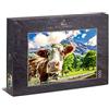 Ulmer Puzzleschmiede - Puzzle Mucche e montagne - Una mucca curiosa davanti a un paesaggio di montagna da sogno nelle Alpi