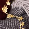 Lights4fun Ghirlanda di Stelle in Tessuto Dorato con 40 Micro LED Bianco Caldo a Pile con Timer Decorazione Natalizio per Interni