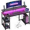 Coleshome Scrivania Gaming con LED, 120x50cm Scrivania Computer con 2 Prese e 2 Porte USB, PC Scrivania con Supporto Monitor e Ripiani di Archiviazione, Scrivania per Ufficio Casa, Nero