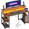 Coleshome Scrivania Gaming con LED, 120x50cm Scrivania Computer con 2 Prese e 2 Porte USB, PC Scrivania con Supporto Monitor e Ripiani di Archiviazione, Scrivania per Ufficio Casa, Marrone