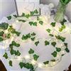 Fielegen Confezione da 4 luci a stringa di edera artificiale con luci, a batteria finta vite di edera con 80 luci a LED da appendere piante vegetali per camera da letto, giardino, festival, stanza