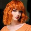 PORSMEER Parrucca corta Bob arancione con frangia per donne parrucca naturale da donna capelli sintetici colorati colorati per feste di Halloween Cosplay parrucche ricci ondulate,12 pollici