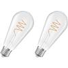 OSRAM Vintage 1906 Edison è una lampada LED a luce bianca calda con un filamento a spirale a forma di lampadina Edison. Offre 3,4 W per 470 lm, attacco E27, vetro trasparente, diametro 64 mm, 2700 K.