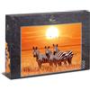 Ulmer Puzzleschmiede - Puzzle Sotto il sole africano - Un piccolo gruppo di zebre sotto il sole nella savana in Africa