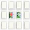YIYINOE Cornice 10 x 15 cm,Set di 12 Cornici Foto da Parete,Corni di Cartone con Pellicola Plastica Antipolvere ad Alta Trasparenza,Bianca
