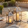 TRIROCKS Set di 2 lanterne decorative in acciaio inossidabile, 34 cm e 26 cm di altezza, portacandele in metallo con vetro temperato per la decorazione della casa, il soggiorno, le feste e per esterni