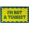 Fisura - Zerbino ingresso casa "I'm not a tourist" in fibra di cocco con base antiscivolo in PVC, tappeto verde dipinto a mano per uso interno, zerbino umoristico 70 x 40 cm
