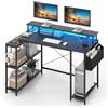 COSTWAY Scrivania Angolare da Gaming, Scrivania Salvaspazio a Forma di L con Luci LED, Stazione di Ricarica, Ripiani e Supporto per Monitor, Scrivania ad Angolo per Casa e Ufficio (Nero)