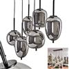 hofstein Lampada a sospensione Verbania, lampada moderna in metallo/vetro in colore nero/fumo, con paralumi in vetro regolabili (Ø 16 cm, 18 cm), altezza massima 128 cm, 6 luci, E14, senza lampadina/e