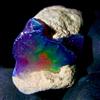 OPAL EMPIRE Natural Black Opal - Ethiopian Fire Opal grezzo 8.50 carati 18x16 mm