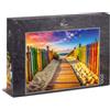 Ulmer Puzzleschmiede Puzzle 1000 pezzi strisce costiere - Ponte in legno tra recinzioni colorate attraverso dune alla costa nella calda luce serale - spiaggia estiva e motivo mare per adulti - Qualità Made in Germany
