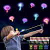 MOYKSRR 15 Pezzi Elicottero Volante con Fionda, Elicottero Volare Giocattolo, Elicotteros a Slingshot Razzo, LED Luminosa Flying Giocattoli, Giocattoli per Feste per Bambini Regali di Natale
