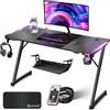 KESSER® Scrivania da Gioco LED - 140 x 60 cm, Scrivania a forma di Z, Gancio per Cuffie e Rivestimento in Carbonio, Ergonomica per PC, con Portabicchieri, Nero Carbonio