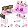 iSunirm Scrivania da gioco forma di L con prese di corrente e luci a LED, piccola scrivania angolare per computer con supporto per monitor e ripiano portaoggetti, borsa portaoggetti, Rosa