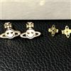Vivienne Westwood Orecchini Vivienne Westwood traforati sfera sorridente bianco/oro NO SCATOLA ...
