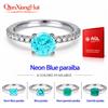 qian xiang hui Anello con pietra YAG sintetica, colore blu-neon con sfumature verdi, tipo Paraiba, 6,5 mm, forma rotonda, argento 925 con moissanite, gioiello con fascia a mezza eternità.