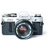 Canon Corpo fotocamera reflex pellicola 35 mm Canon AE-1 con obiettivo FD 50 mm F1....